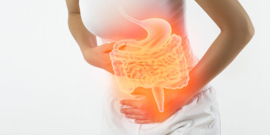 Woman touching stomach